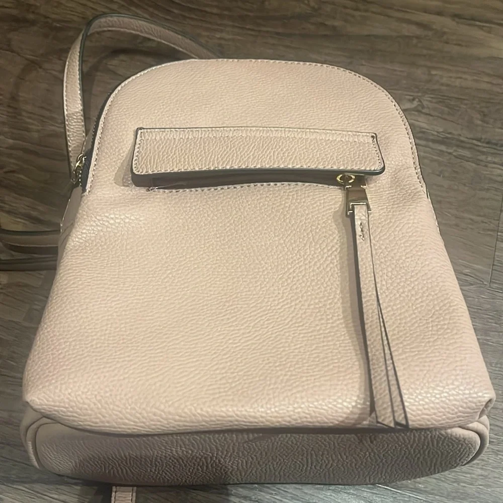 small pink faux leather backpack